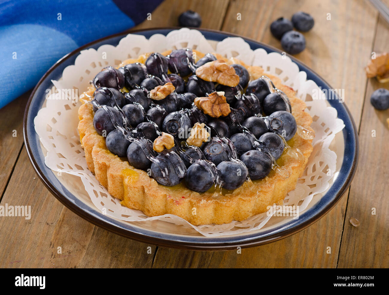 Tart with blueberries  on a wooden table. Stock Photo