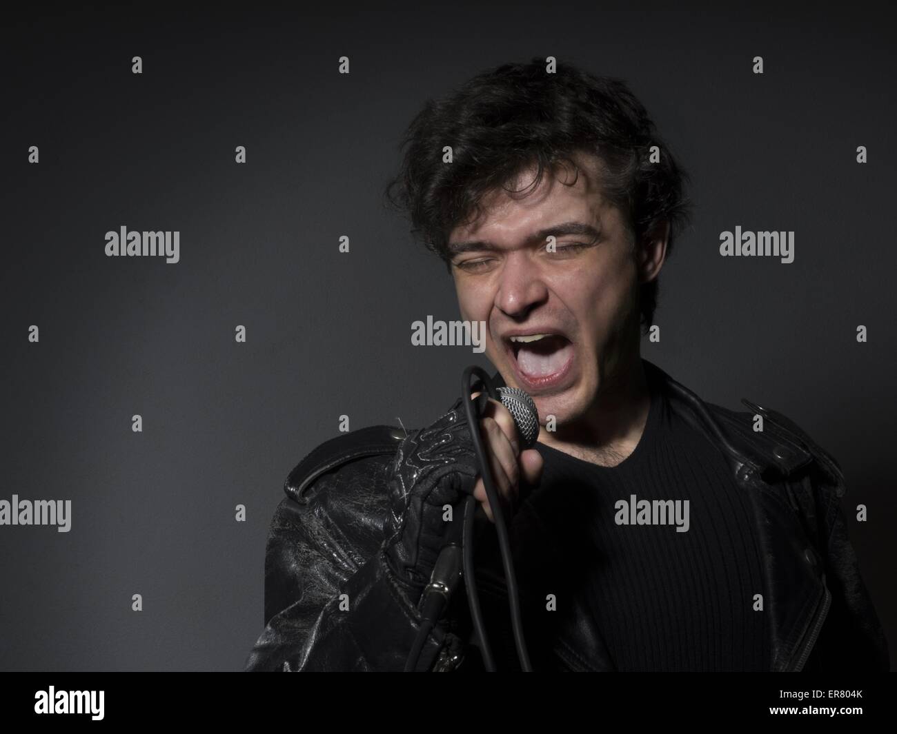 Singer Shouting Feb. 21, 2014 - Rock singer screaming on the microphone (Credit Image ...