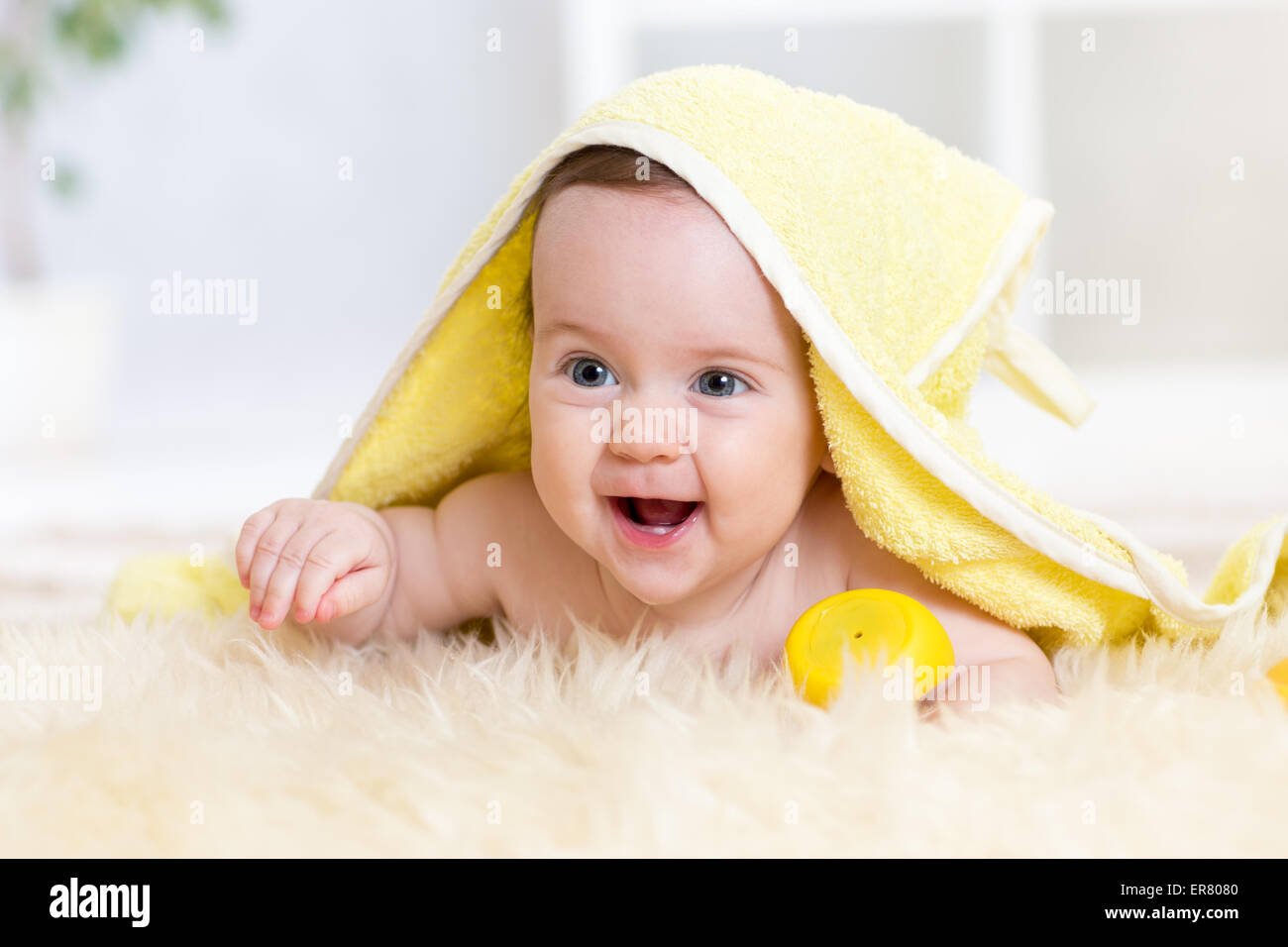 Cute baby girl in bath towel indoors Stock Photo Alamy