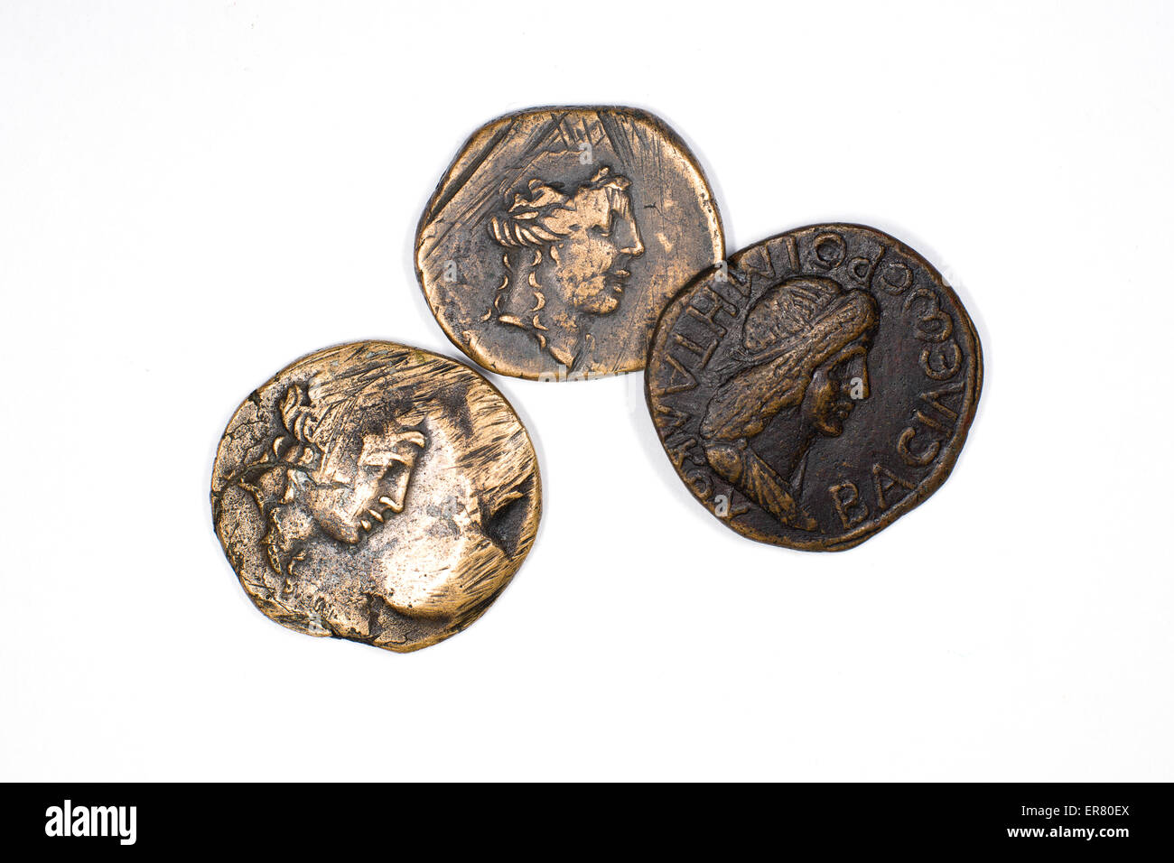Old bronze coins with portraits of kings on a white background Stock Photo