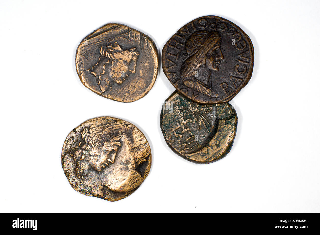 Old bronze coins with portrait of king on a white background Stock Photo