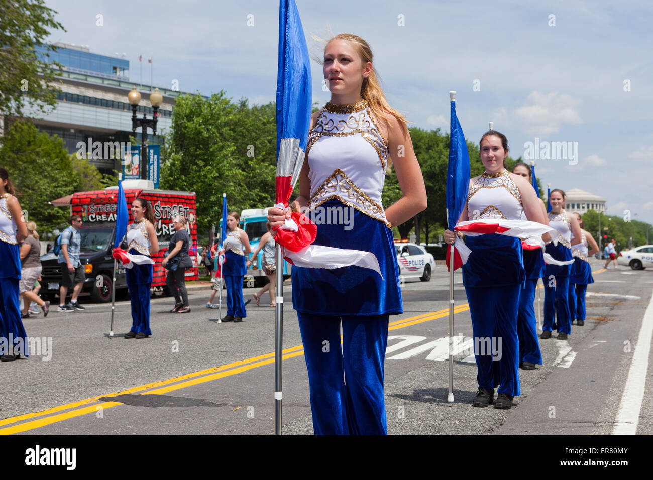 High school marching band color guard in parade - USA Stock Photo
