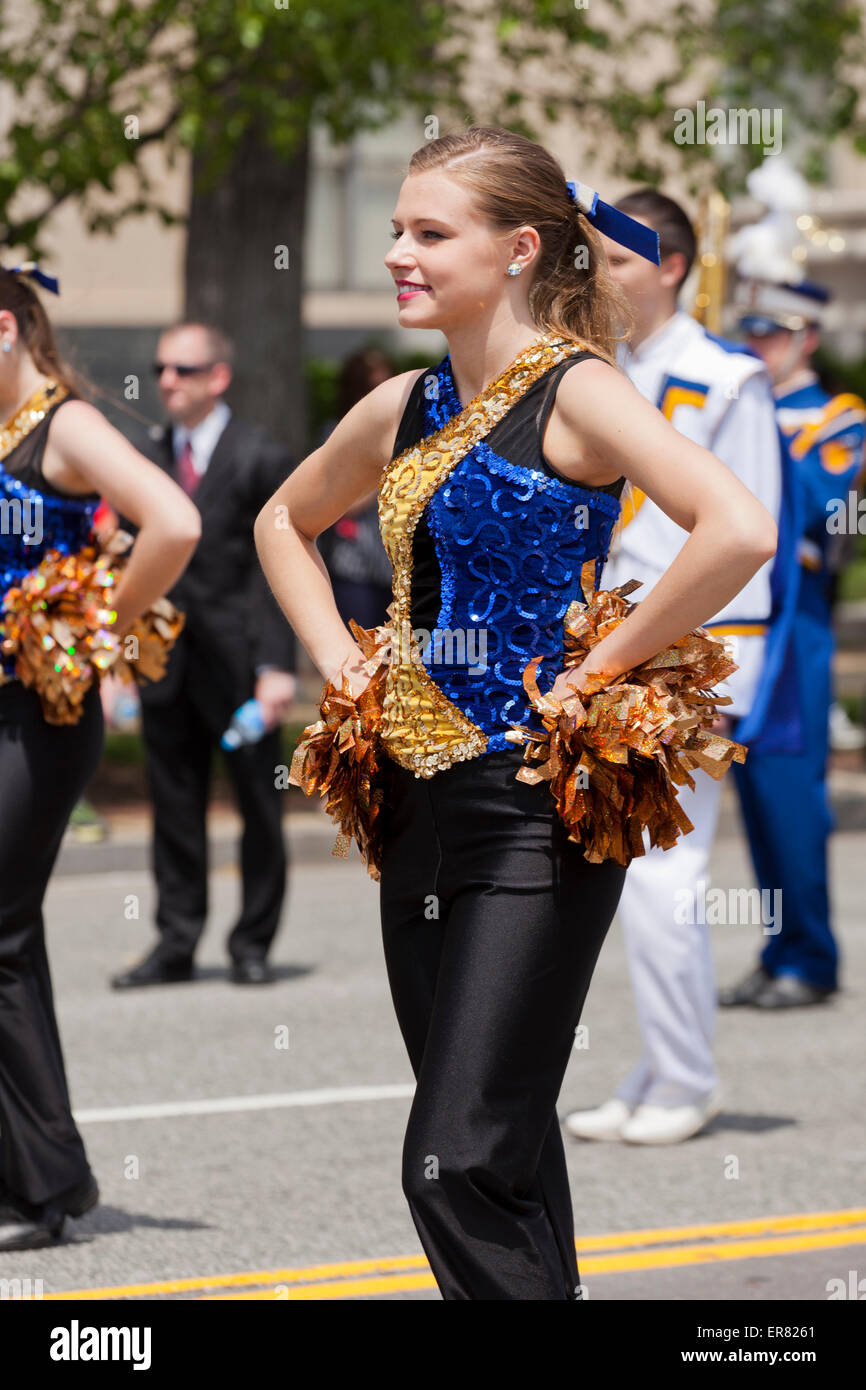 Young Caucasian high school cheerleaders in parade - USA Stock Photo