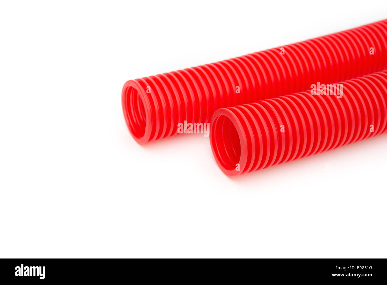 red plastic pipes on a white background Stock Photo Alamy