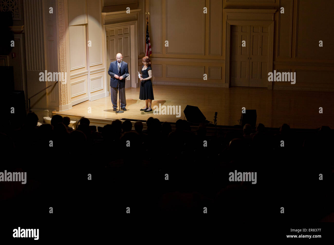 Presenters standing on stage - USA Stock Photo
