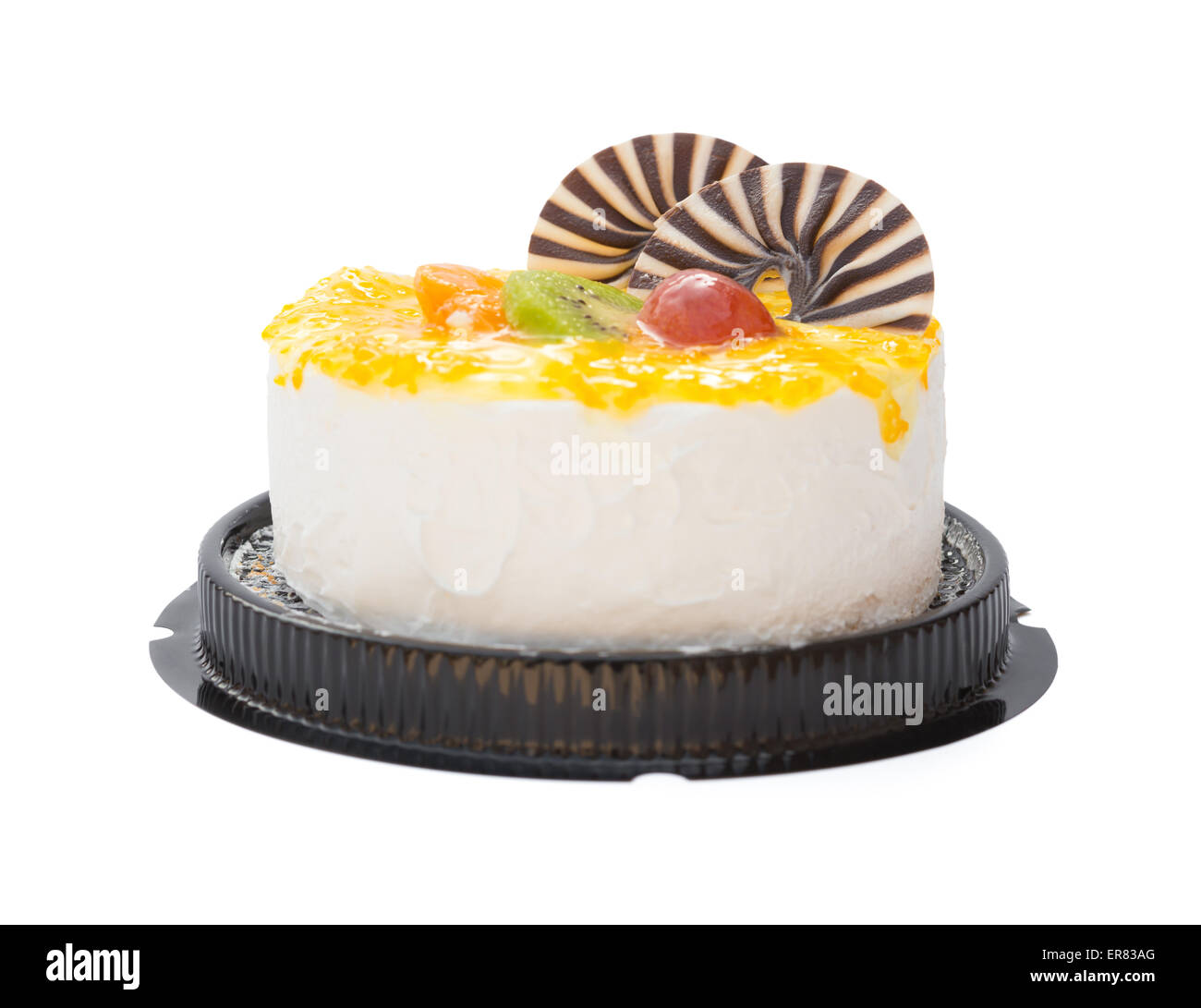 yummy cake on white with grape orange kiwifruit and chocolate on top, clipping path included Stock Photo