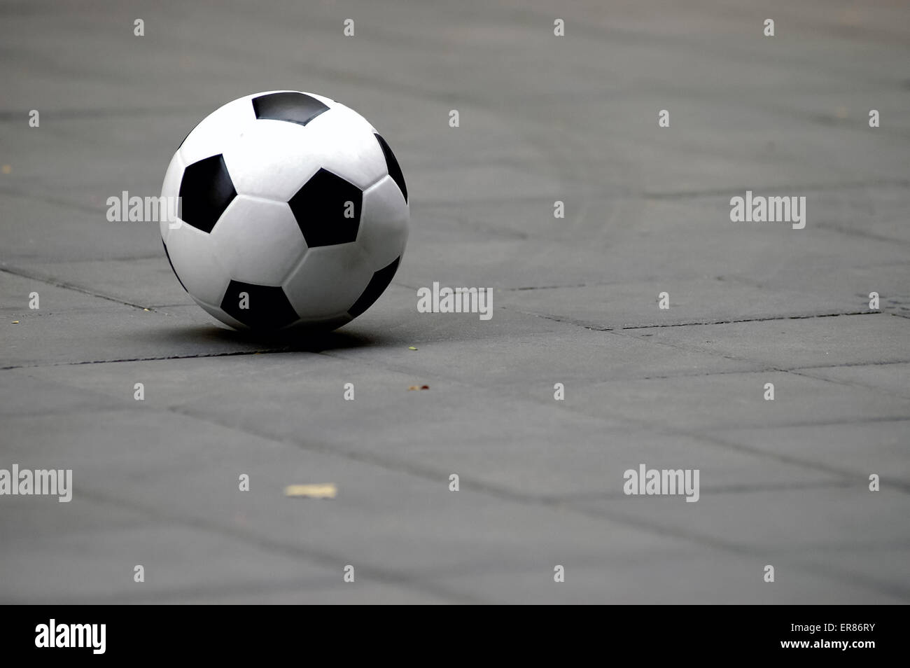 Generic football soccer ball laying on a ground Stock Photo