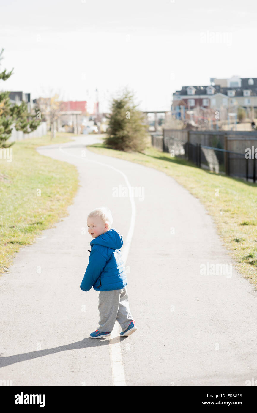 Full length side view of baby boy walking on road Stock Photo Alamy