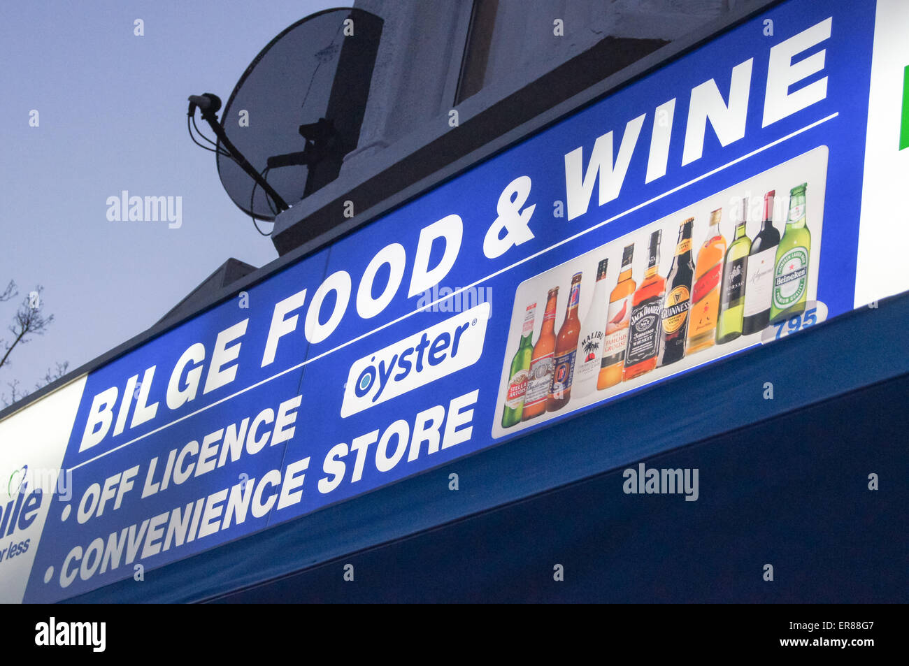 Illuminated shop sign of "Bilge Food" convenience store corner shop