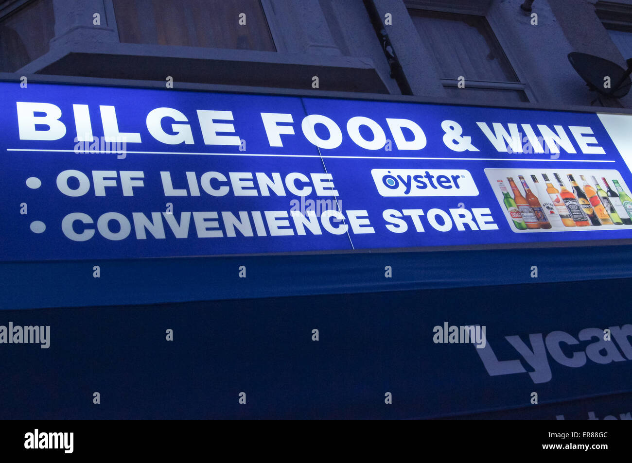 Illuminated shop sign of "Bilge Food" convenience store corner shop