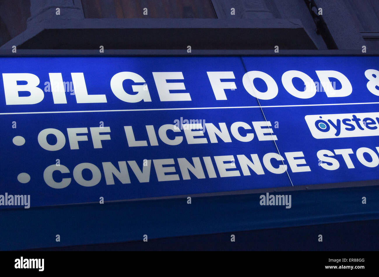 Illuminated shop sign of "Bilge Food" convenience store corner shop