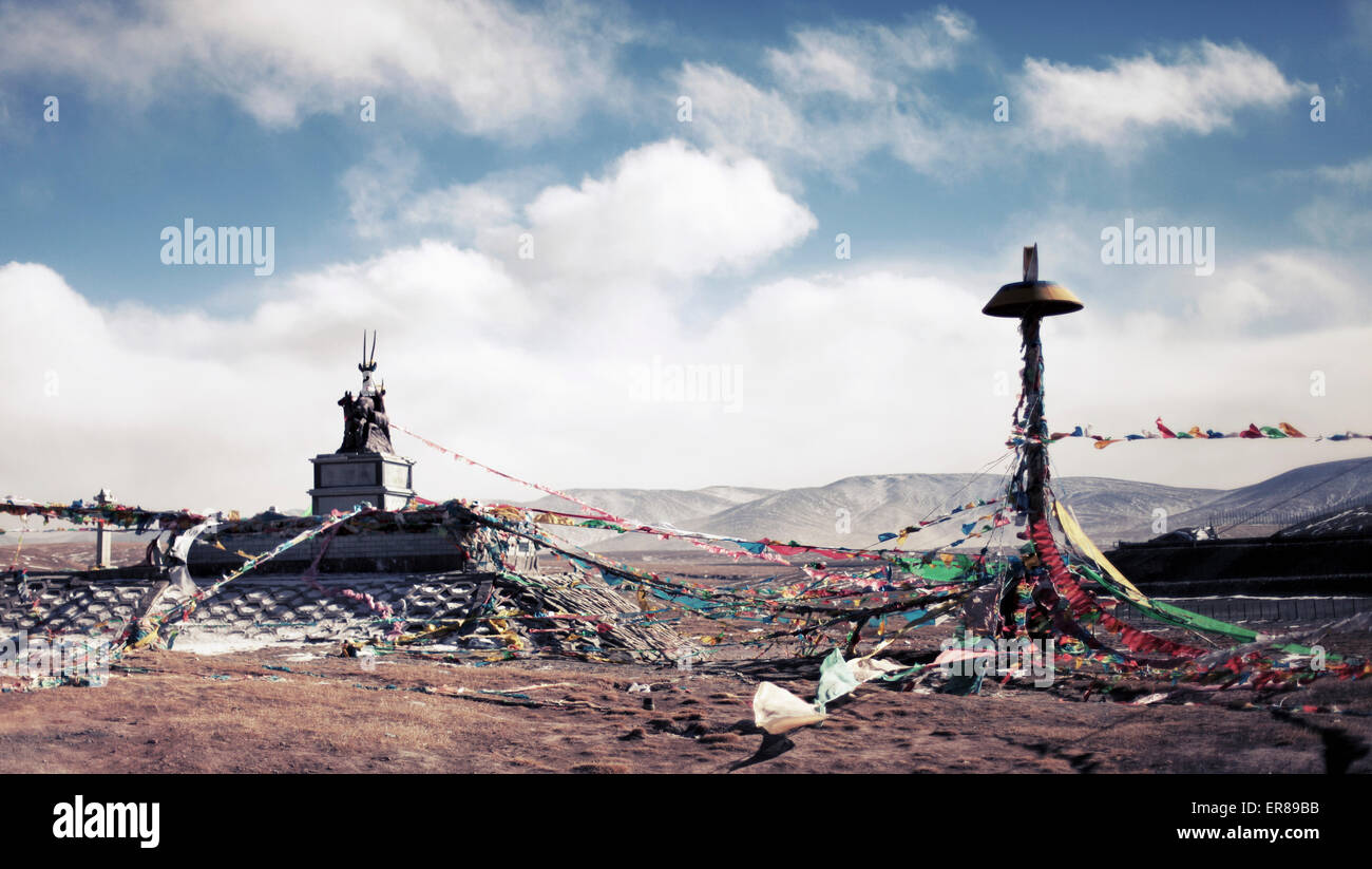 Tangled bunting on mountain against cloudy sky, Yushu Tibetan Autonomous Prefecture, China Stock Photo