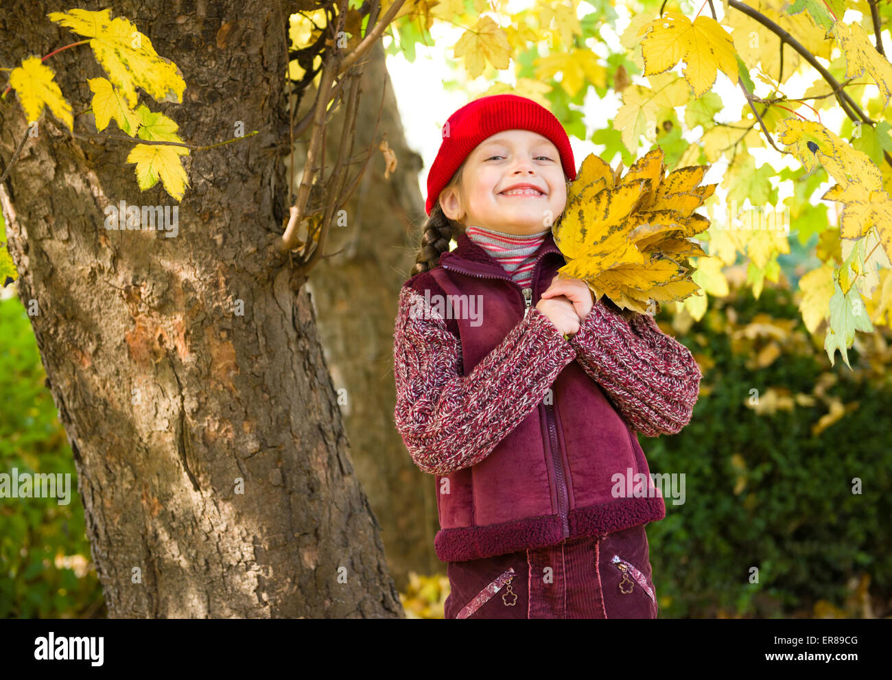 little girl in autumn park Stock Photo - Alamy