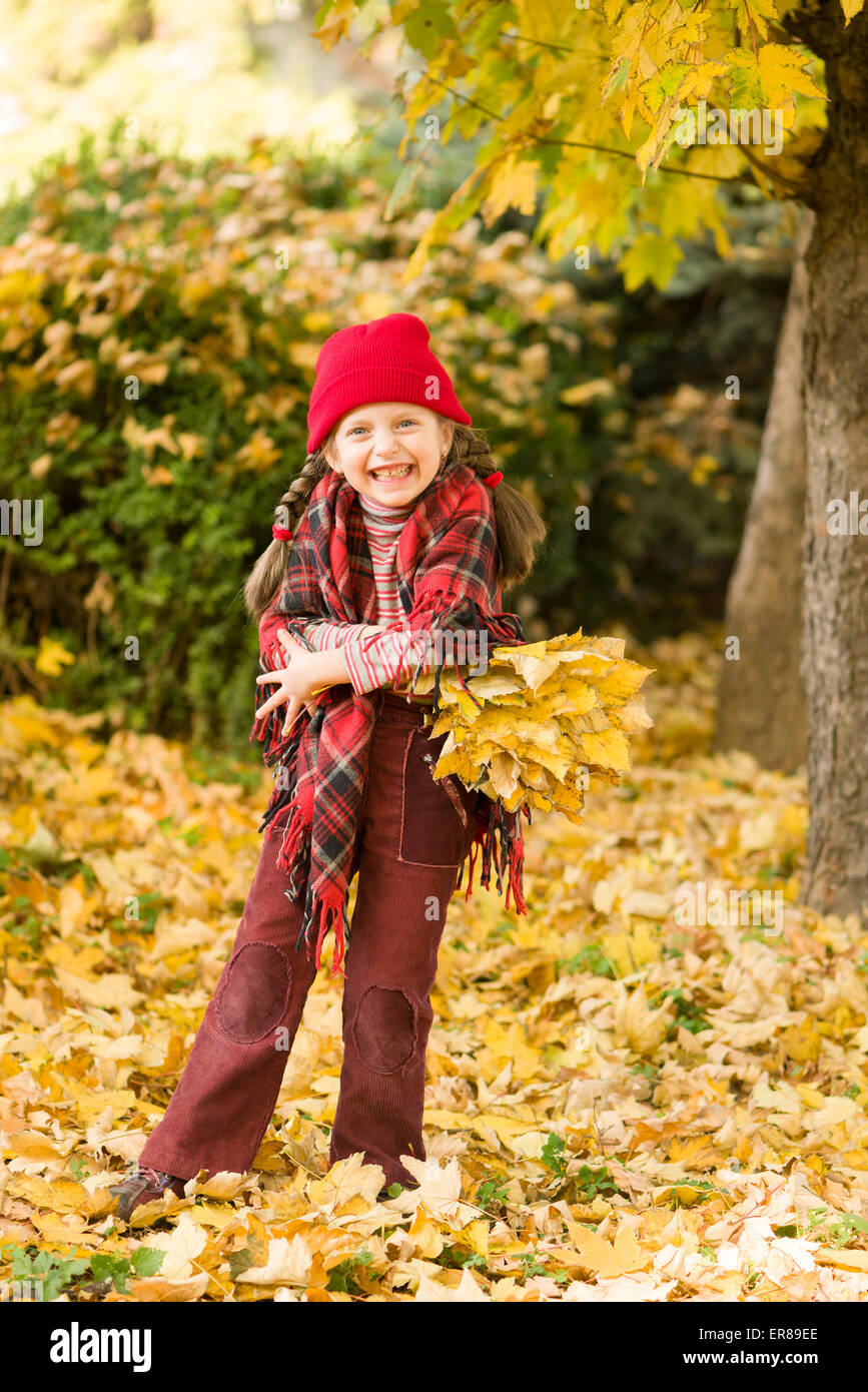 little girl in autumn park Stock Photo - Alamy