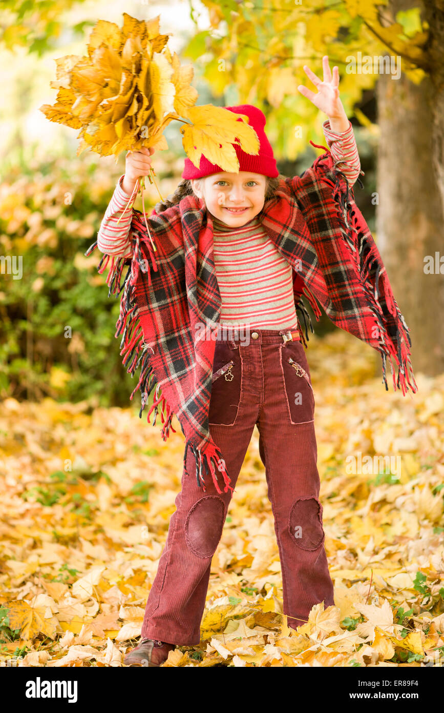 little girl in autumn park Stock Photo - Alamy