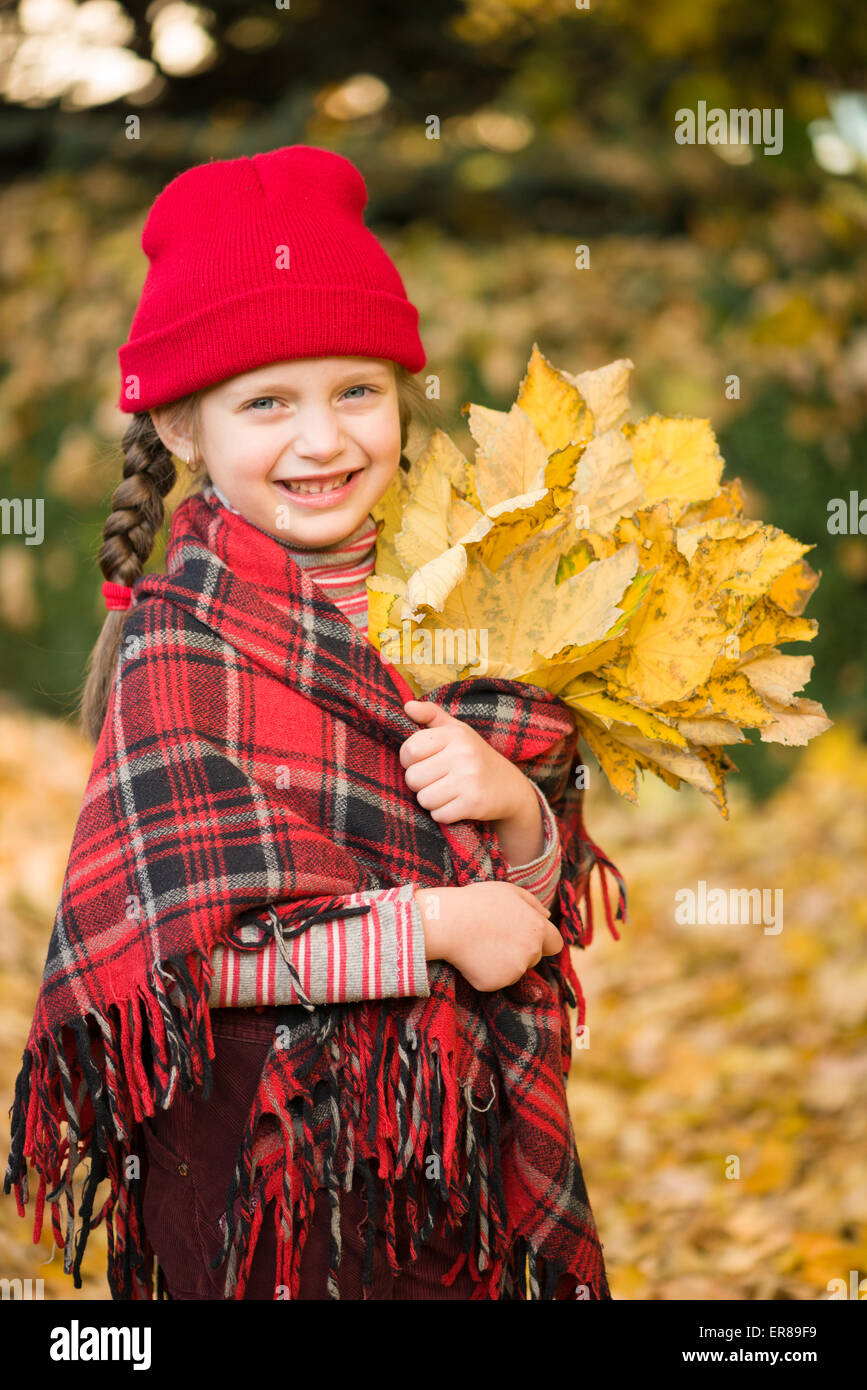 little girl in autumn park Stock Photo - Alamy