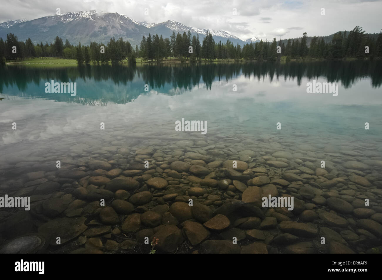 clear lake and snow mountain range Stock Photo - Alamy