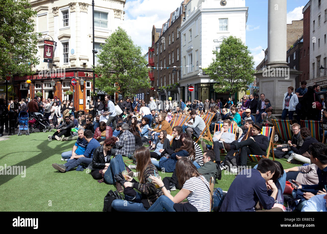 Seven Dials Roundabout Closed off for Concert during Spring Shopping Event in Covent Garden - London UK Stock Photo