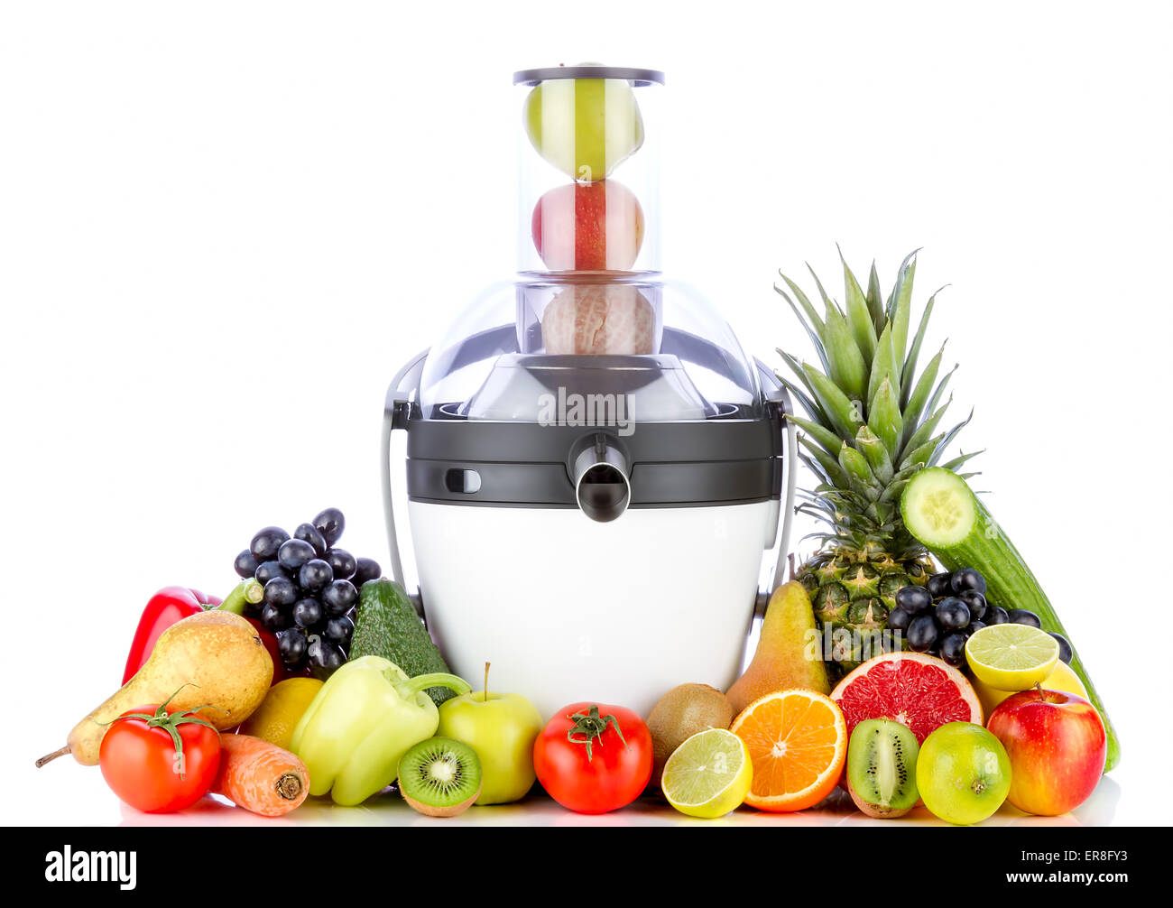 Fruits and vegetables for juice near juicer on white background. Healthy fruits eating and drinking. Stock Photo