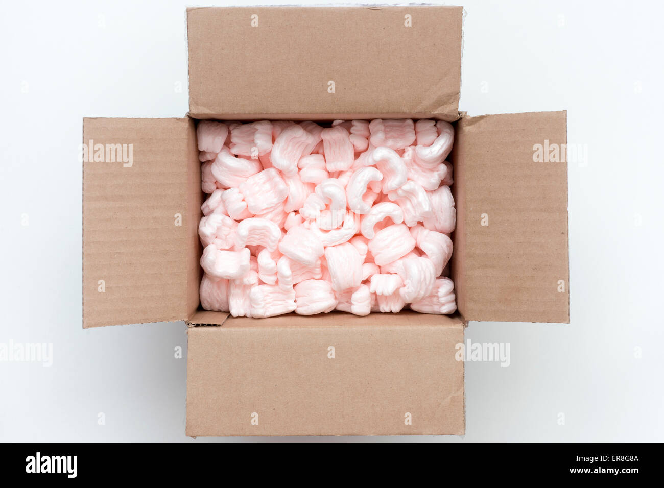carton packing box wide open with pink packaging filling inside Stock ...