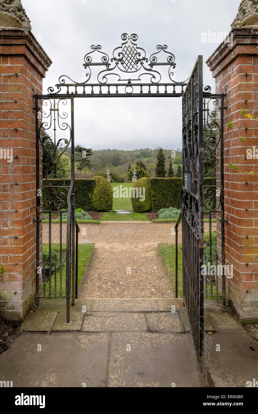 View across Ranmore Common and Surrey Hills through a gate at Polesdon Lacey, Great Bookham, near Dorking, Surrey, England, UK. Stock Photo