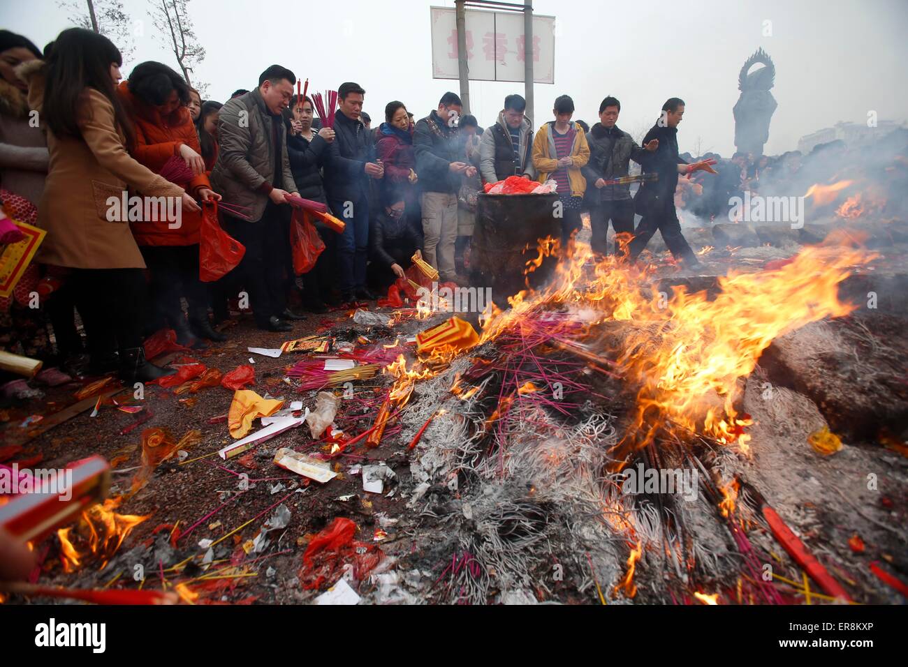 Feb 23, 2015-Wuhan, China- Chinese worshippers burn incenses to pray at the GuiyuanTemple in the hope that it brings them prospe Stock Photo