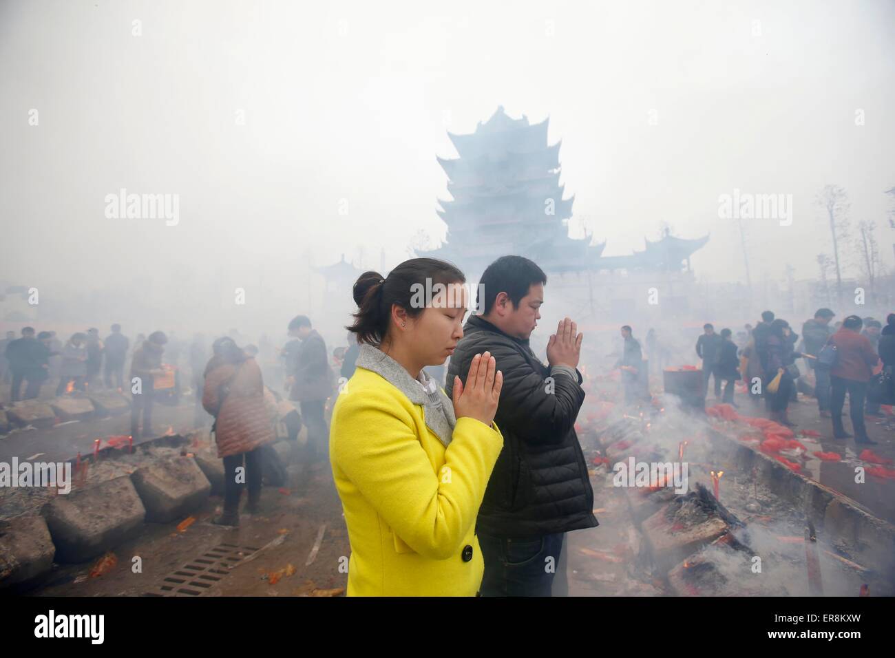 Feb 23, 2015-Wuhan, China- Chinese worshippers  worship at the GuiyuanTemple in the hope that it brings them prosperity and good Stock Photo