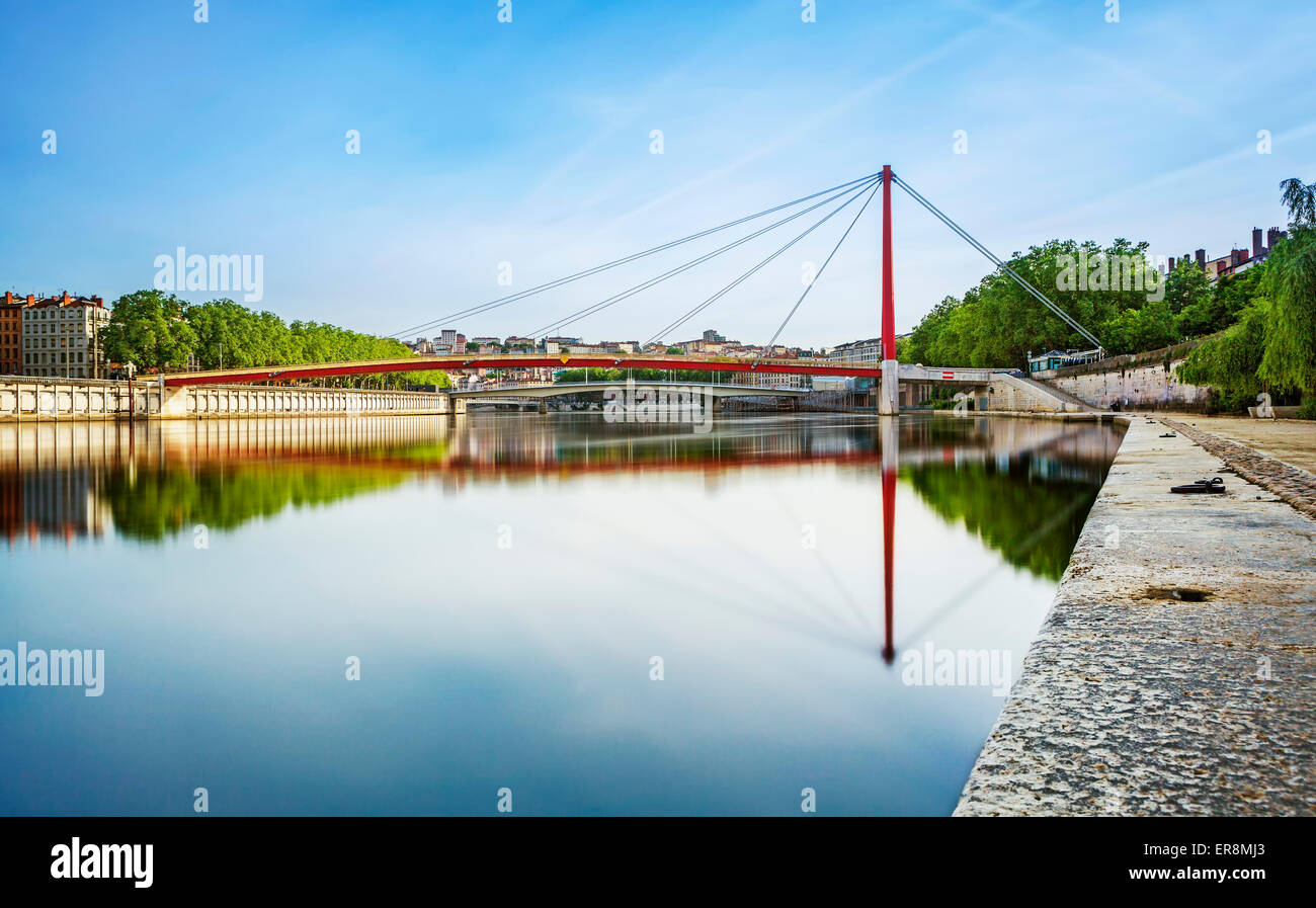 Wide red bridge over the Soane in Lyon city, France Stock Photo