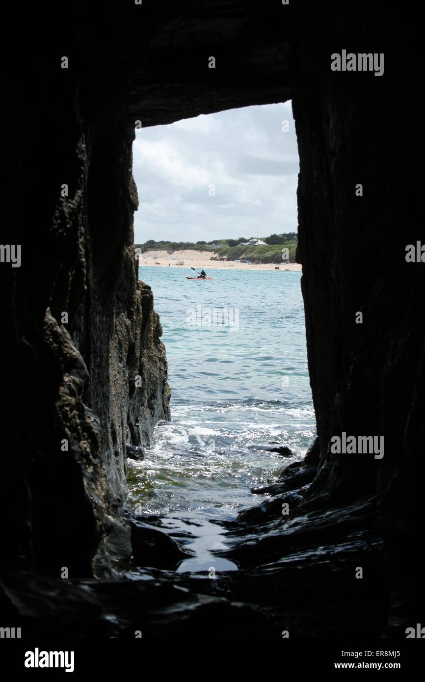 Looking through the tunnel on the Old Fish Cellars beach to Harlyn Sands Beach, Cornwall Stock Photo