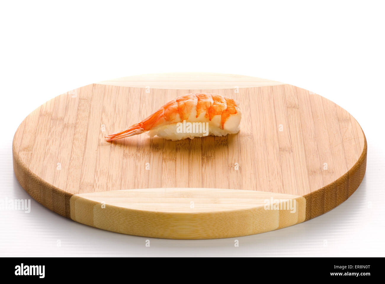 Shrimp sushi on a wooden plate. Isolated on white background Stock Photo