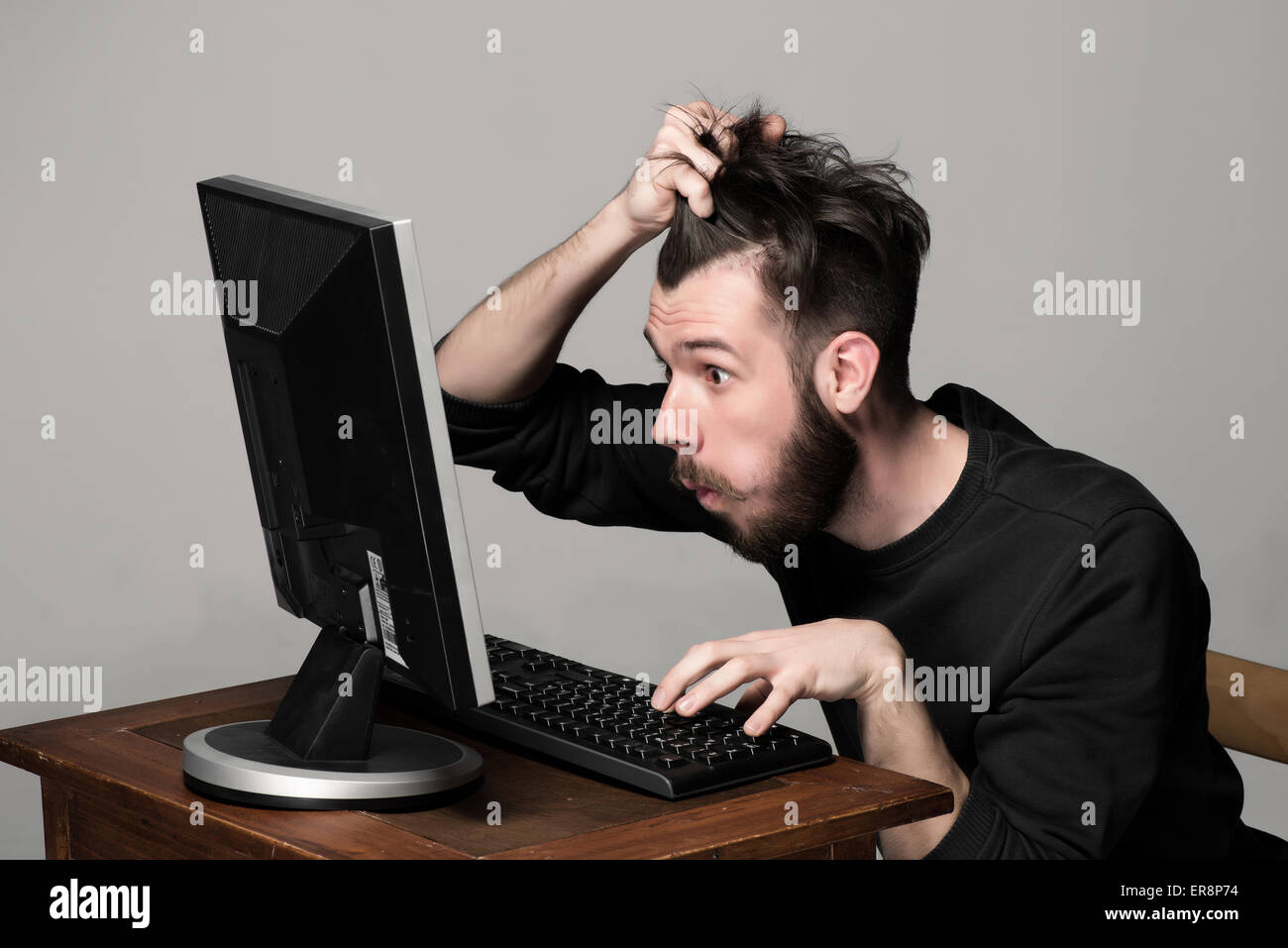 Funny and crazy man using a computer Stock Photo Alamy