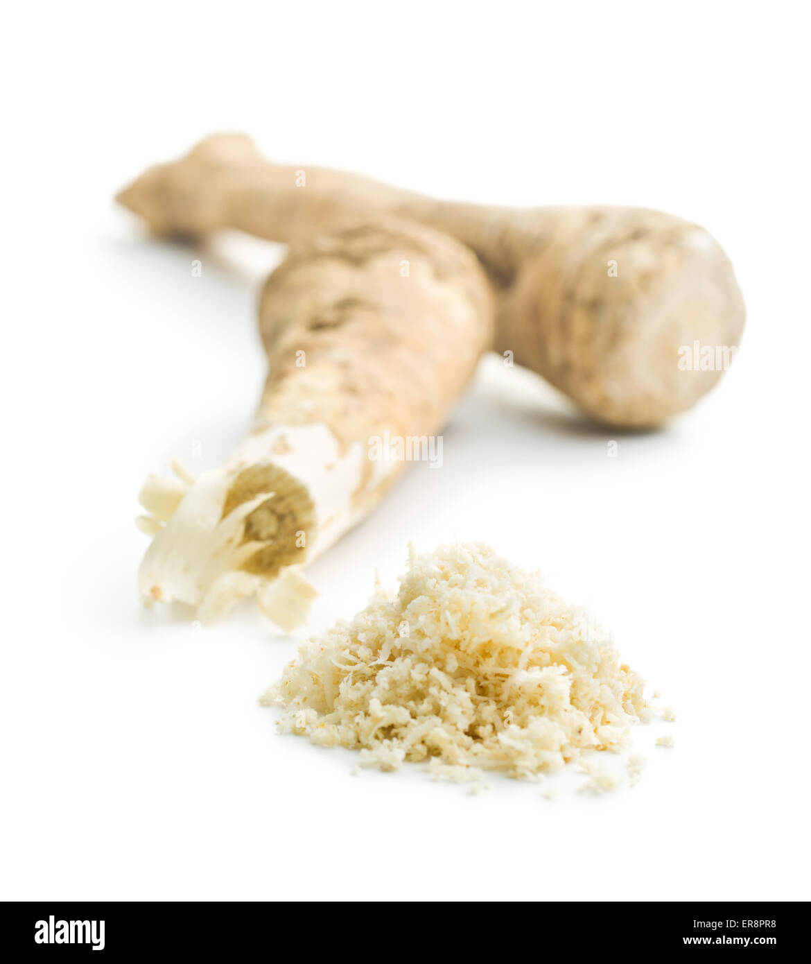 grated horseradish root on white background Stock Photo Alamy