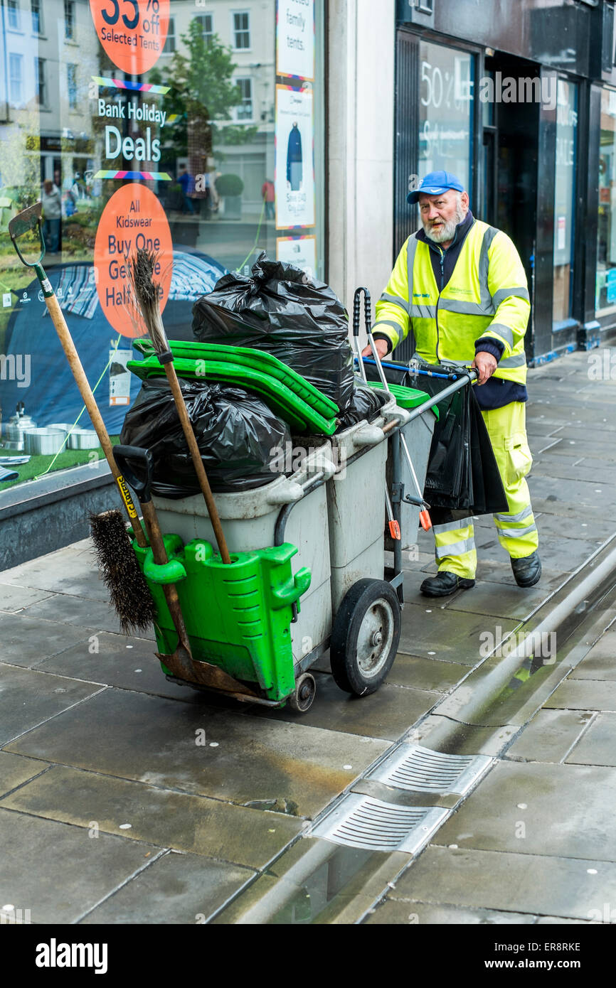 Street Cleaner with truck cleaning the streets with dust cart Salisbury