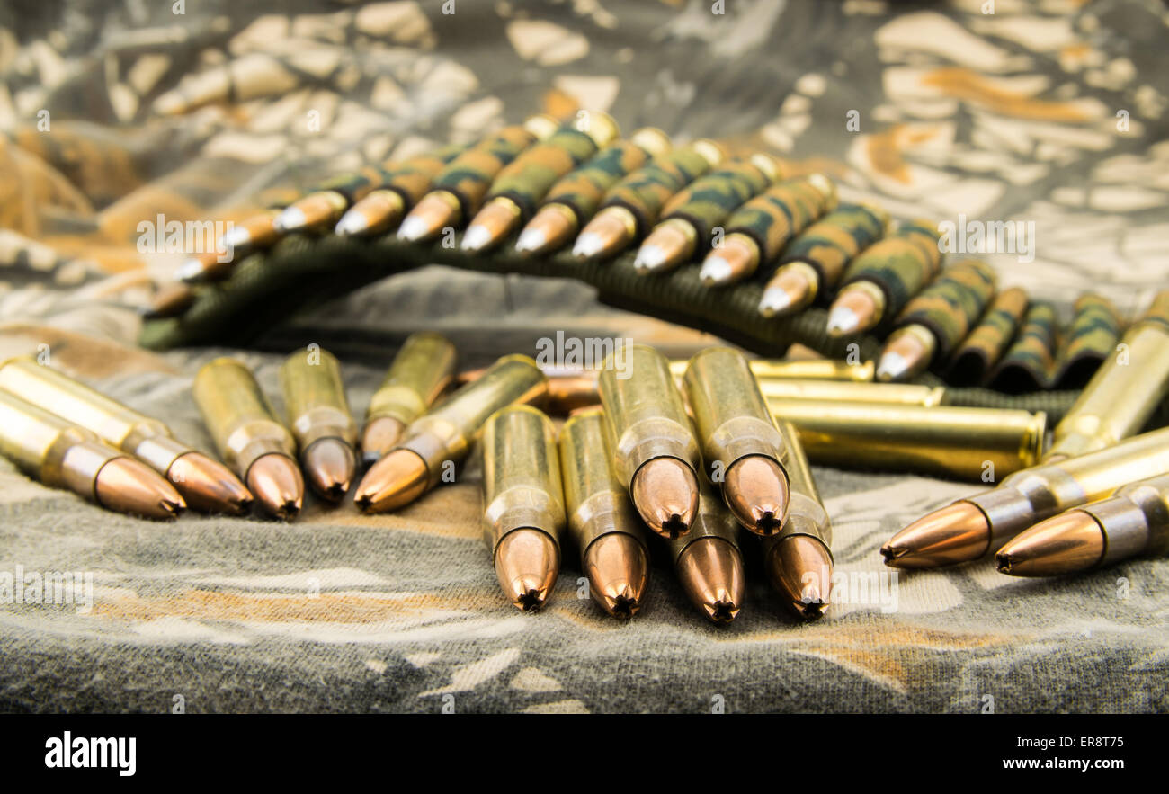 composition with camouflage ammunition belt for assault rifle Stock Photo