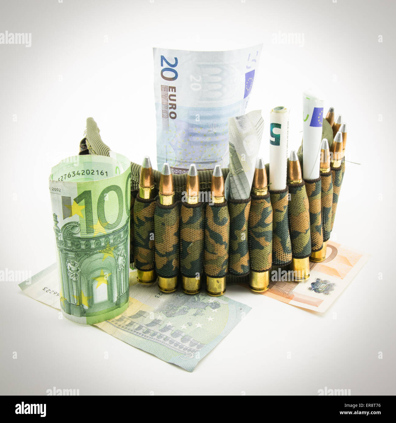 composition with bullets and banknotes on white background Stock Photo