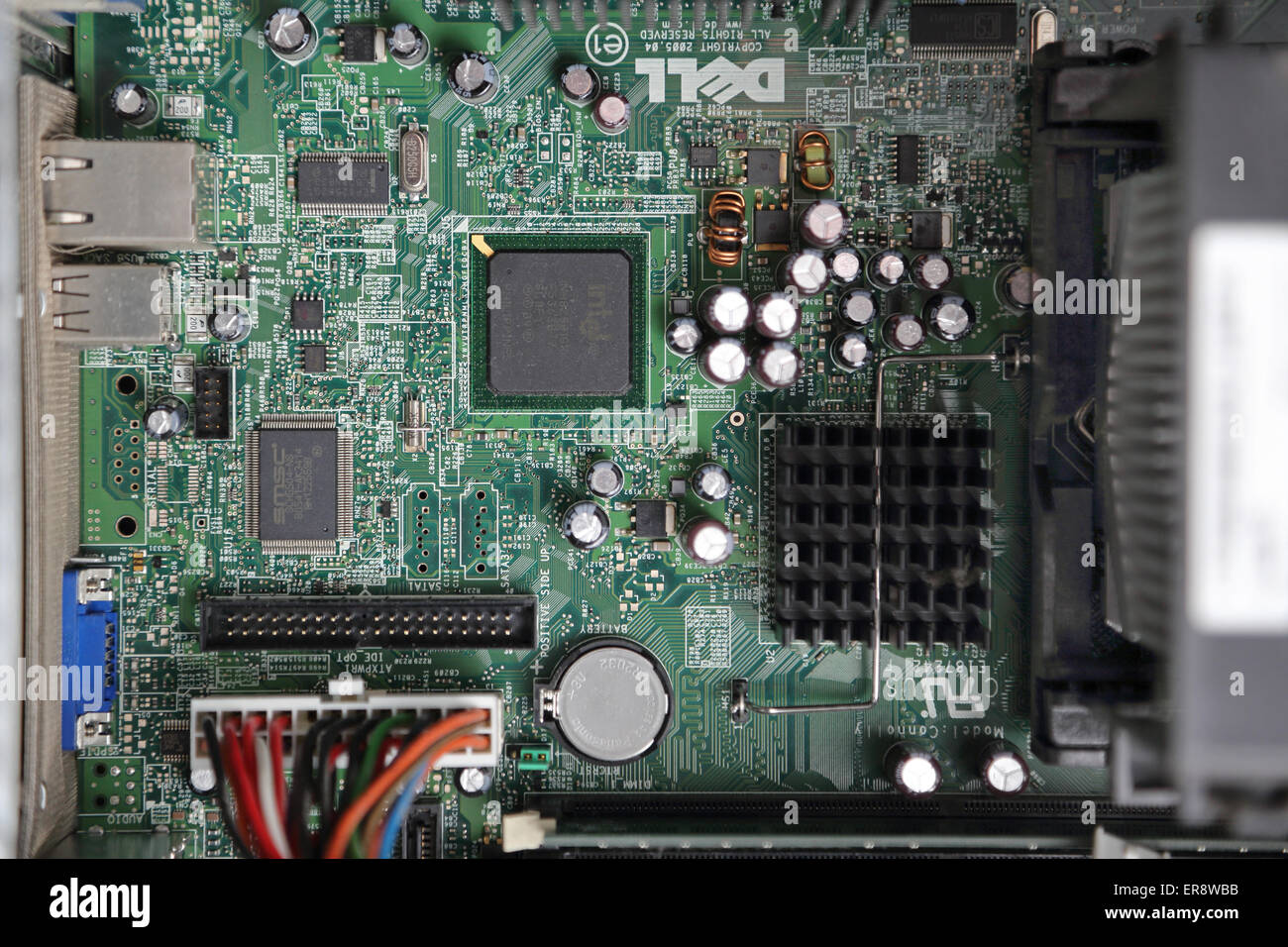 The circuit board on the inside of a modern desk top computer showing microchips and other components Stock Photo