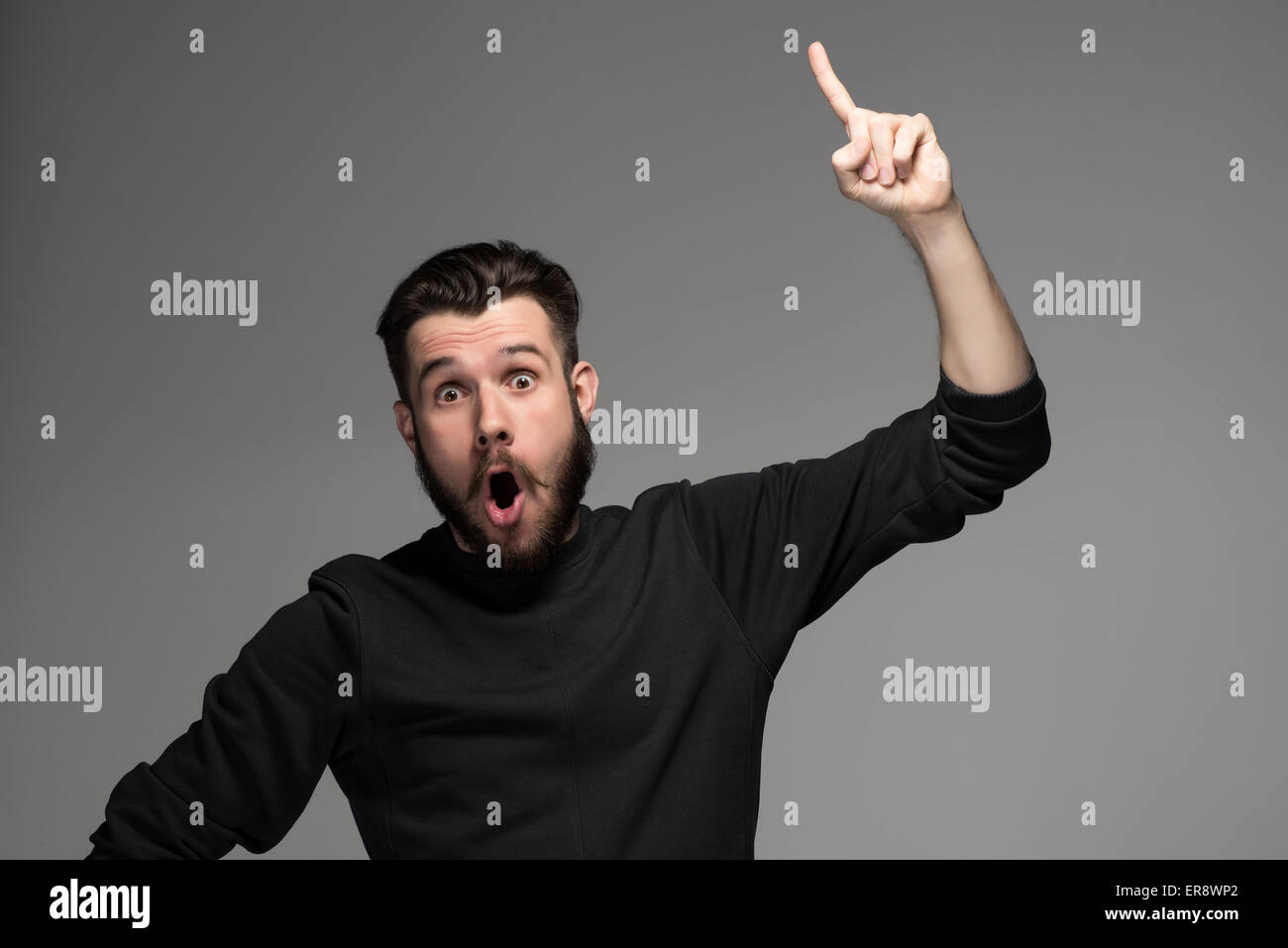 Eureka. man with an idea raising his finger in the air Stock Photo Alamy