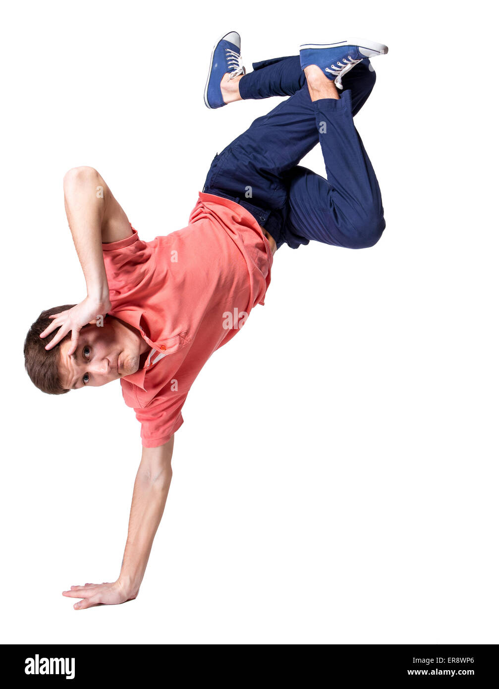 Break dancer doing one handed handstand against a white background Stock Photo