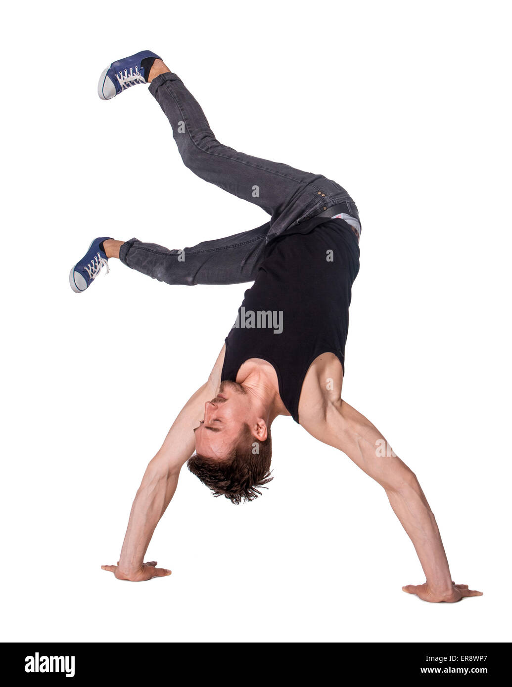 Break dancer doing handstand against  white background Stock Photo