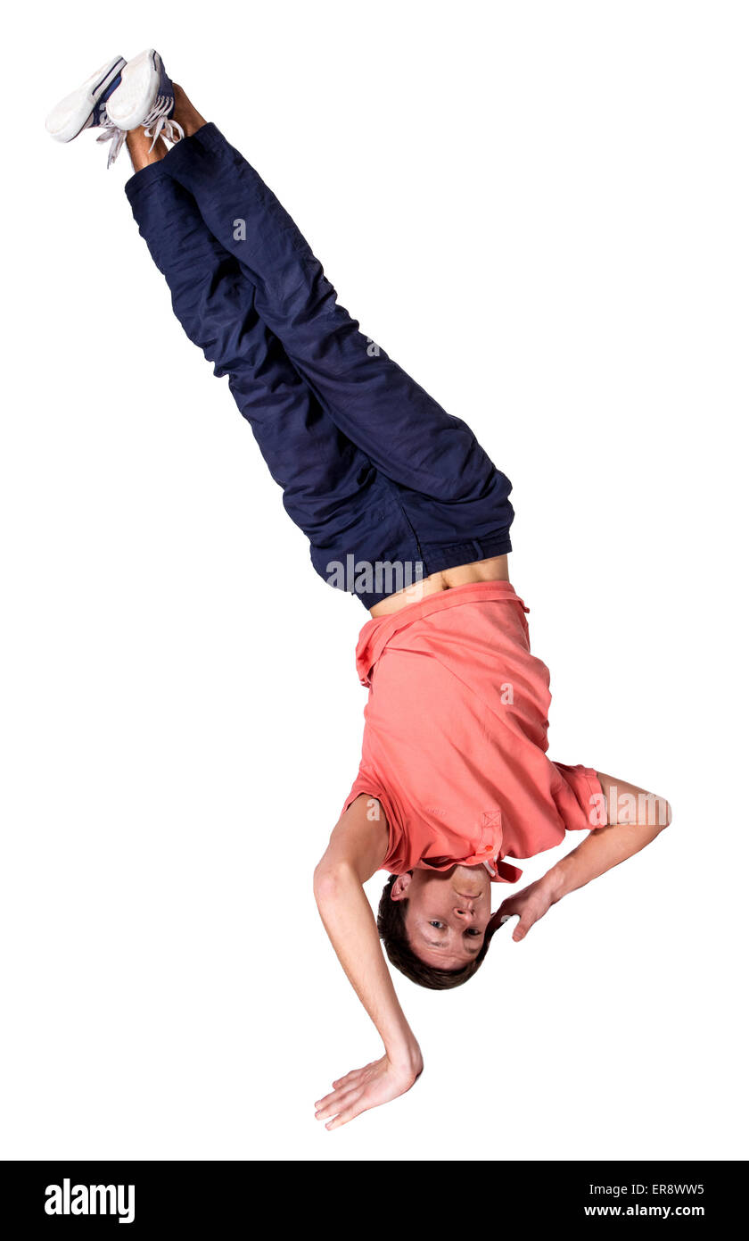 Break dancer doing one handed handstand against a white background Stock Photo