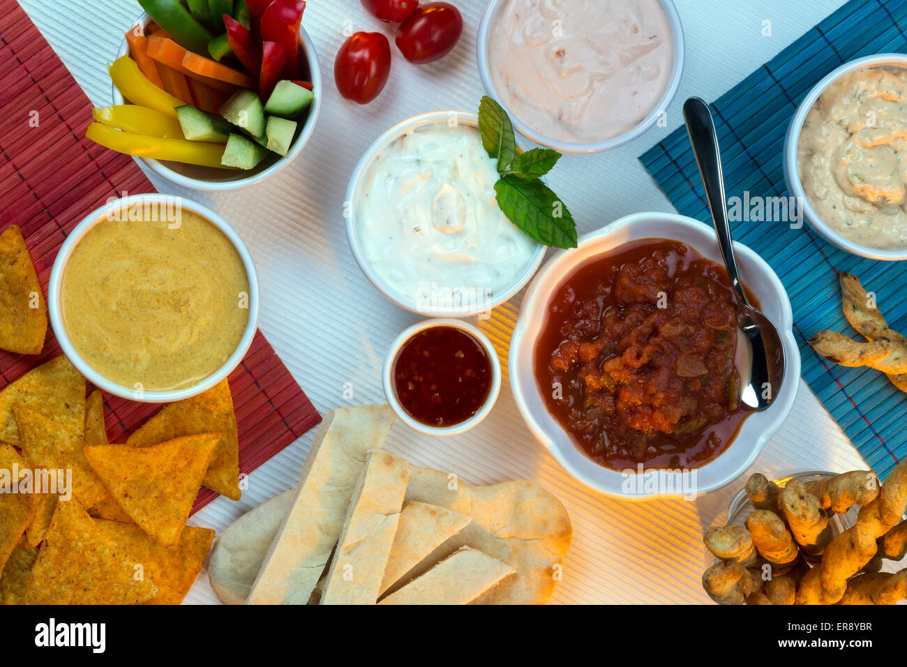 A selection of party dips with bread sticks and other crudites Stock