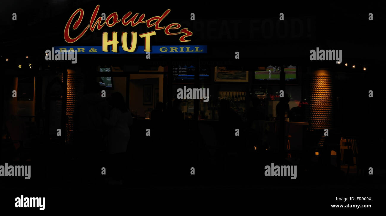 Night neon view entrance to Chowder Hut Bar Grill seafood restaurant