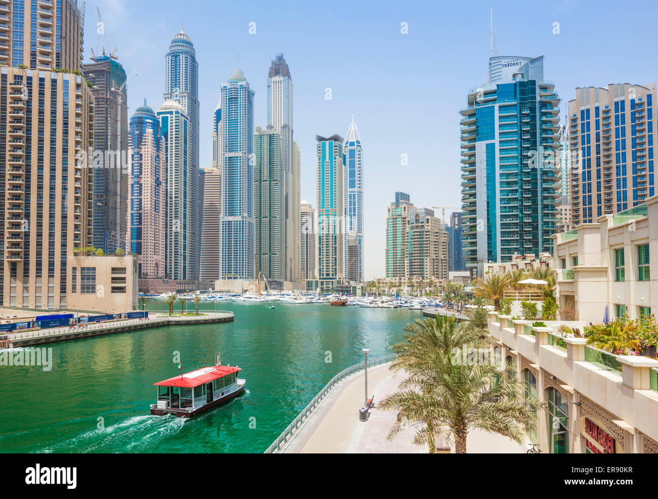 Dubai Marina Skyline and harbour with water taxi Dubai City United Arab Emirates UAE Middle east Stock Photo