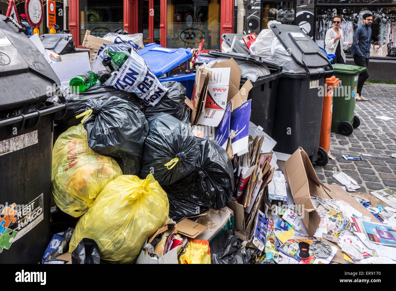 Pile of rubbish bags and garbage containers with household refuse