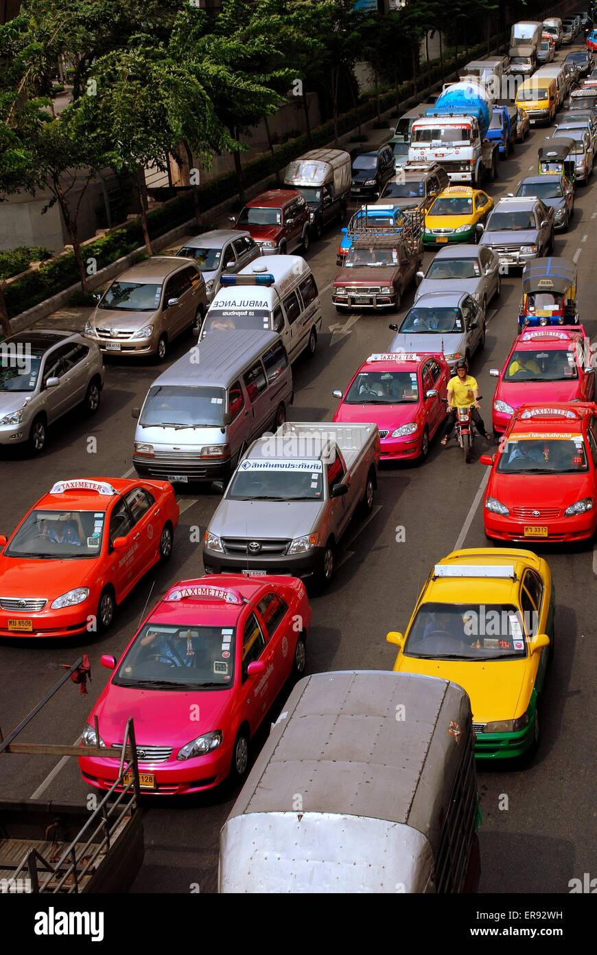 Bangkok, Thailand: Bumper-to-bumper traffic congestion as taxis, vans, and  passenger cars creep along Sathorn Neva Stock Photo - Alamy