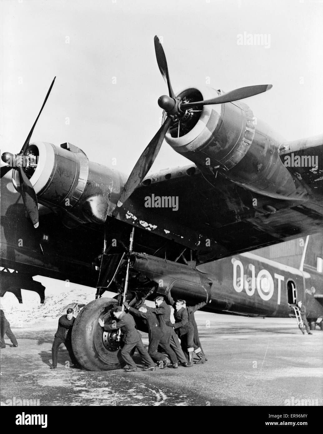 SHORT STIRLING Mk 1 of 149 Squadron RAF at Mildenhall, Suffolk, in January 1942. Ground crew push OJ-T out of its hanger for servicing. Photo US Official Stock Photo