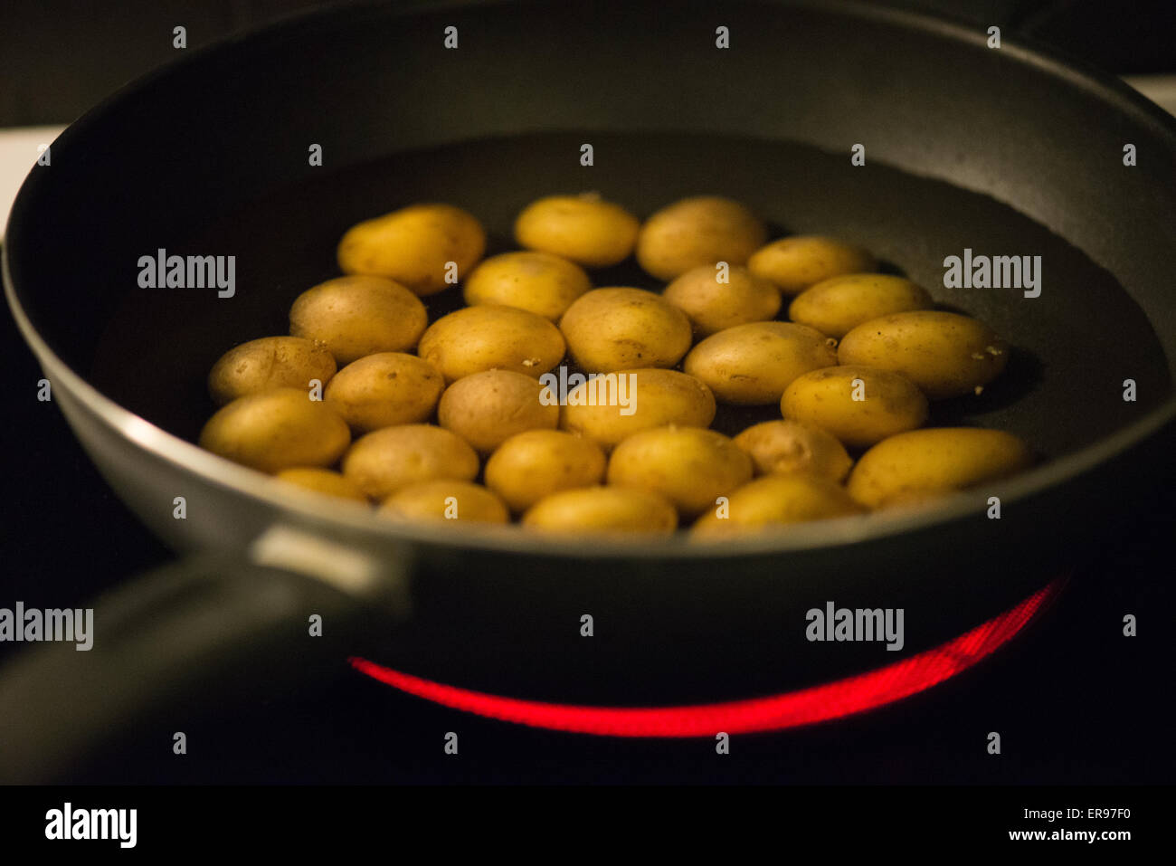 Boiling potatoes Stock Photo