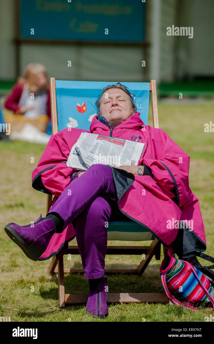 Hay on Wye, UK. Thursday 28 May 2015  Pictured: A woman relaxes in the sunshine at Hay Re: The 2015 Hay Festival takes place in Hay on Wye, Powys, Wales Stock Photo