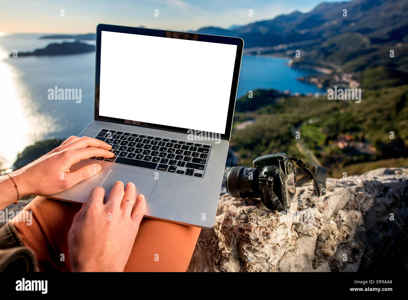 Man with laptop on the top of mountain Stock Photo - Alamy