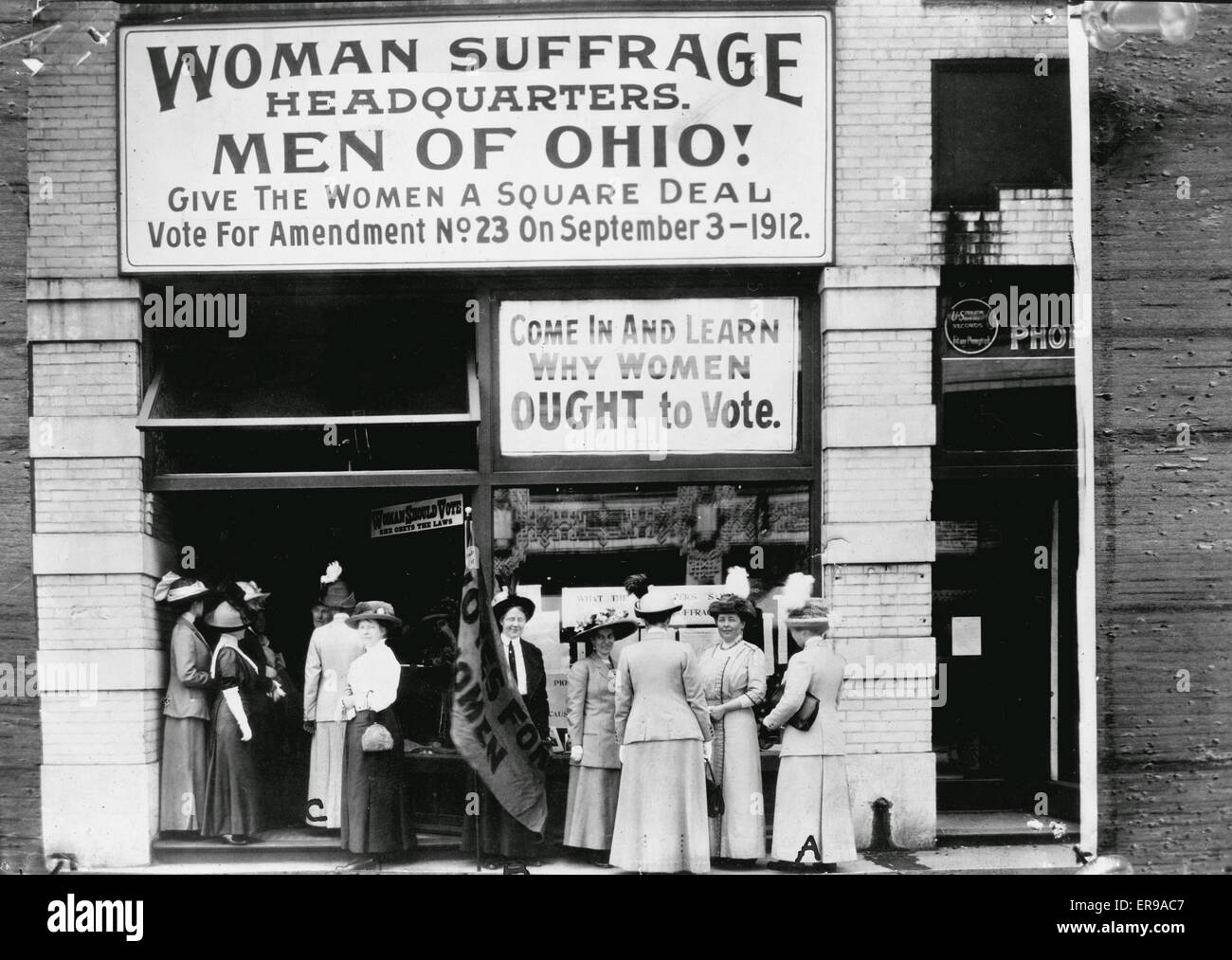 Woman suffrage headquarters in Upper Euclid Avenue, Cleveland - A. (at extreme right) is Miss Belle Sherwin, President, National League of Women Voters; B. is Judge Florence E. Allen (holding the flag); C. is Mrs. Malcolm McBride. 1912 Stock Photo